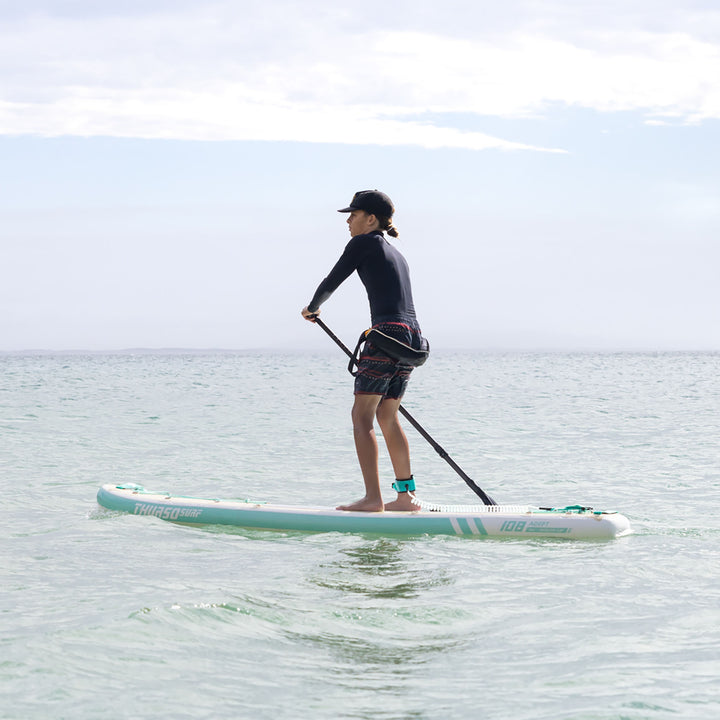 boy paddling on thurso surf adept paddle board looking forward