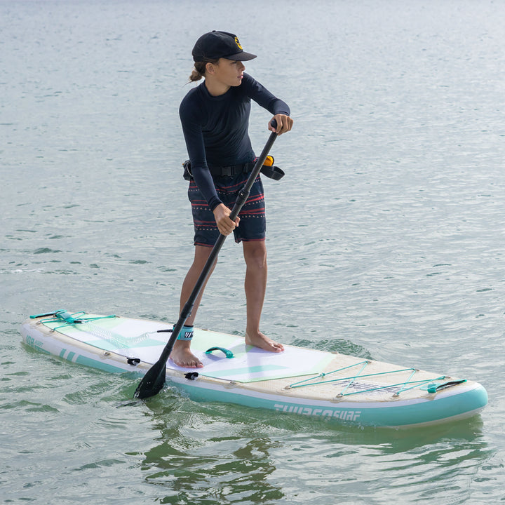 boy paddling on thurso surf adept paddle board